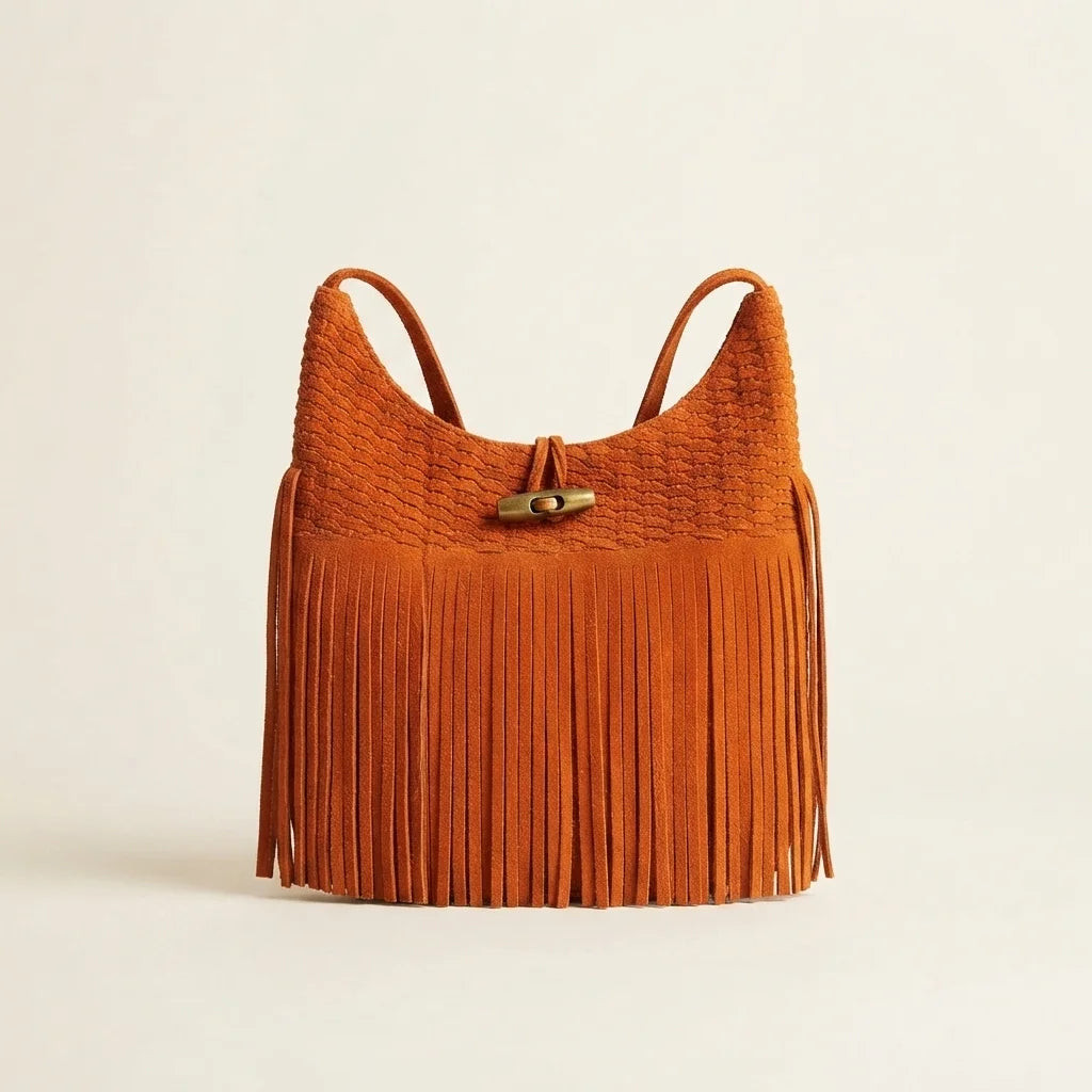Orange tassel fringe hobo bag, front view
