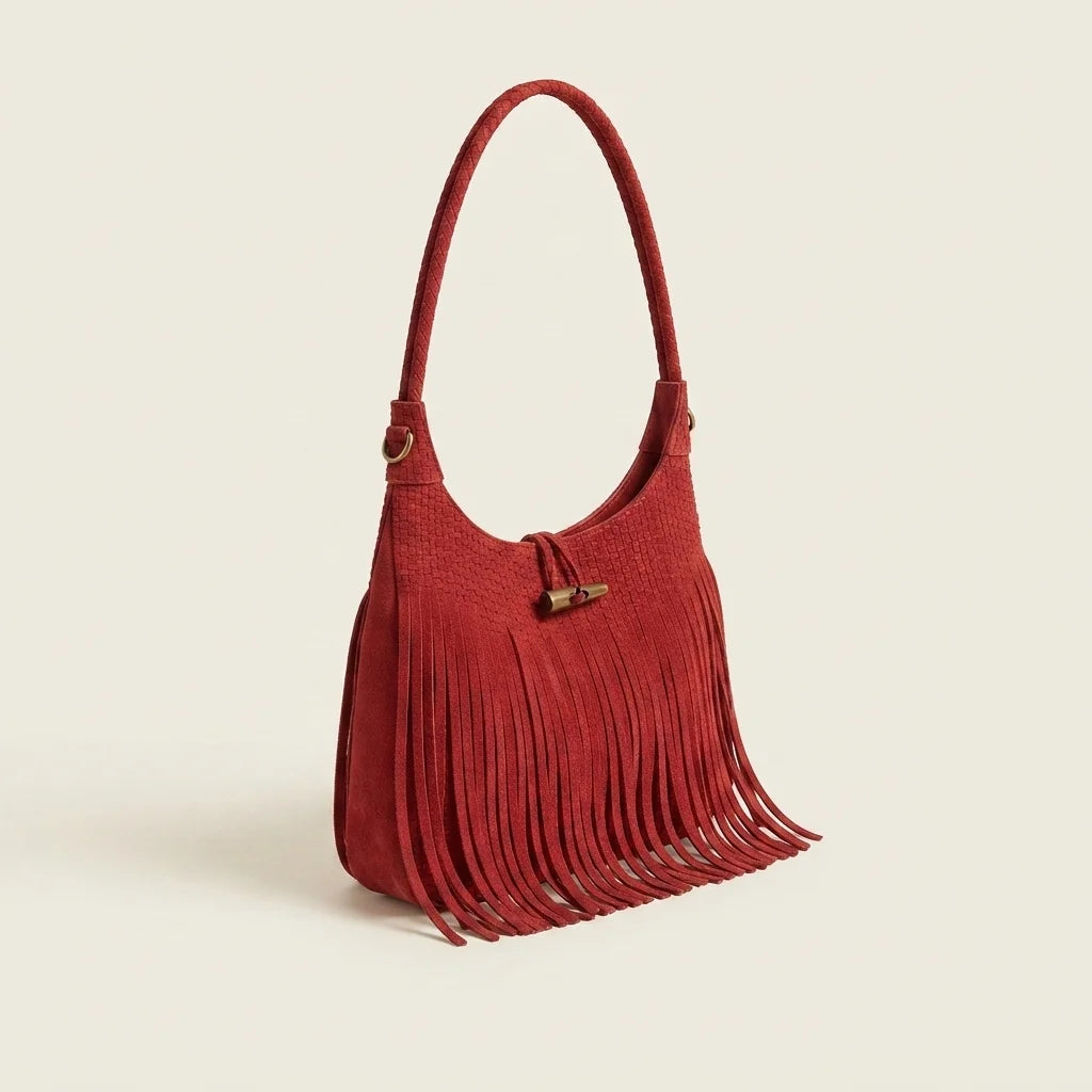 Red tassel fringe hobo bag, three-quarter angle showing side depth