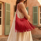 Woman wearing Red tassel fringe hobo bag with swaying fringe