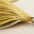 Close-up of fringe stitching and texture on Yellow tassel fringe hobo bag