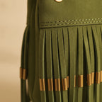 Close-up of fringe stitching and texture on Green turquoise fringe bag
