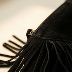 Close-up of fringe stitching and texture on Black vegan fringe hobo bag