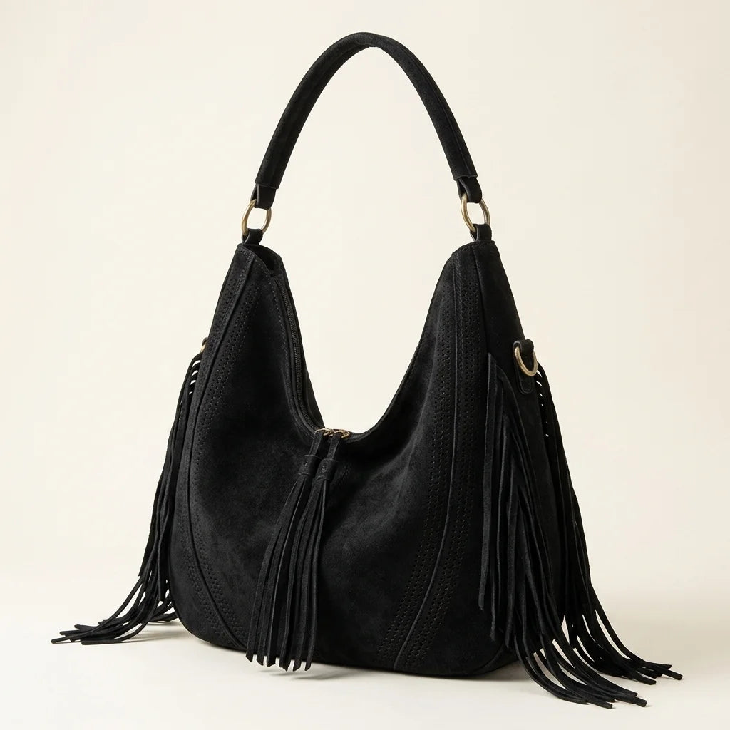 Black vegan fringe hobo bag, three-quarter angle showing side depth