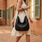 Woman wearing Black vegan fringe hobo bag with swaying fringe