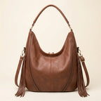 Back panel of Brown vegan fringe hobo bag with strap attachments