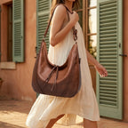 Woman wearing Brown vegan fringe hobo bag with swaying fringe