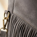 Close-up of fringe stitching and texture on Grey vegan fringe hobo bag