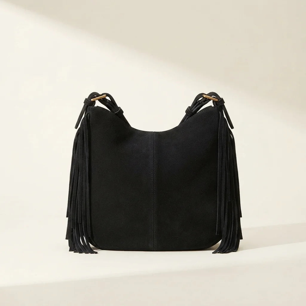 Back panel of Black vintage boho fringe bag with strap attachments