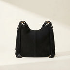 Back panel of Black vintage boho fringe bag with strap attachments