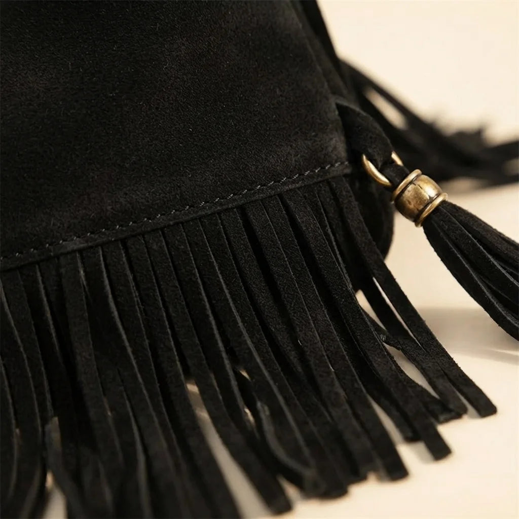 Close-up of fringe stitching and texture on Black vintage boho fringe bag