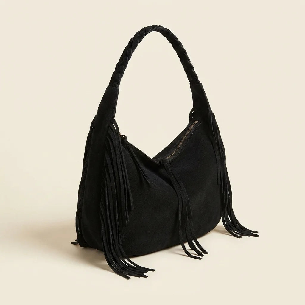 Black vintage boho fringe bag, three-quarter angle showing side depth