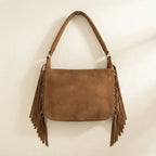 Back panel of Brown vintage boho fringe bag with strap attachments