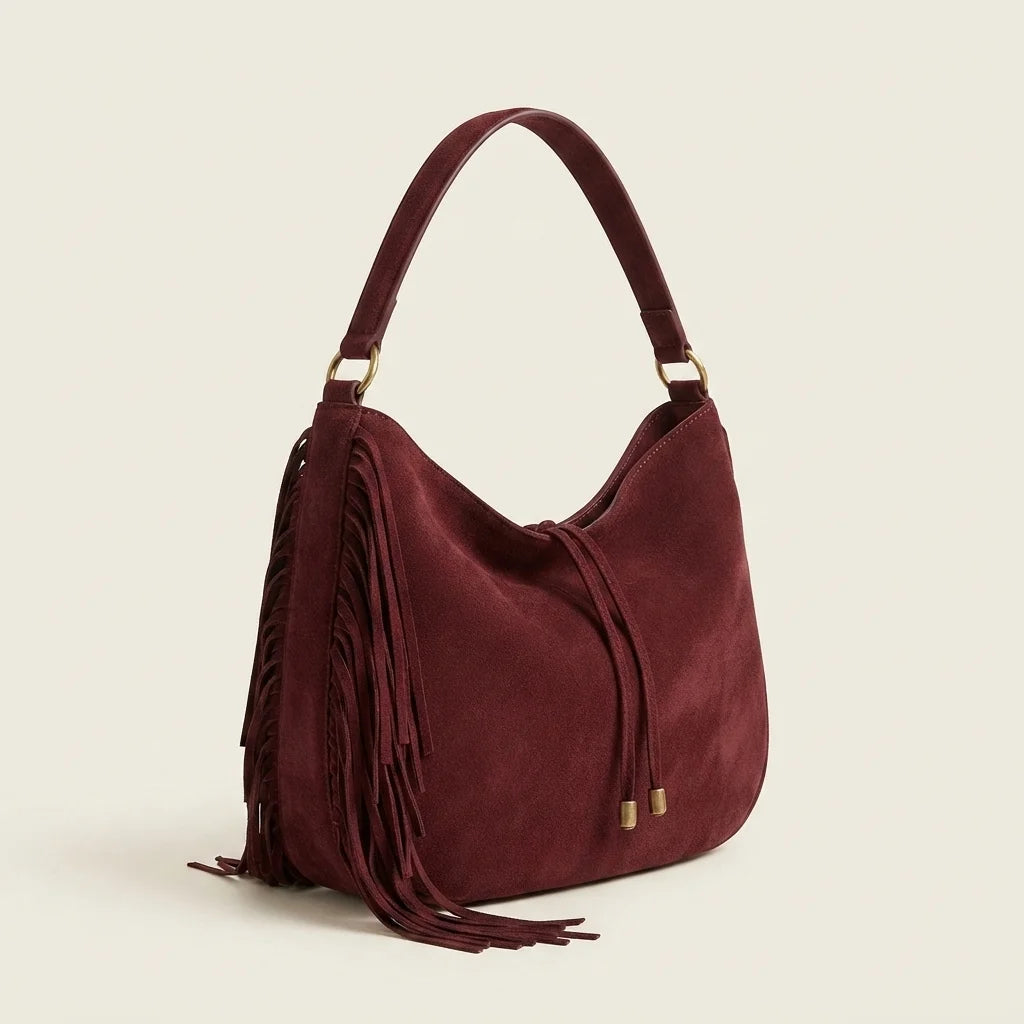 Red vintage boho fringe bag, three-quarter angle showing side depth