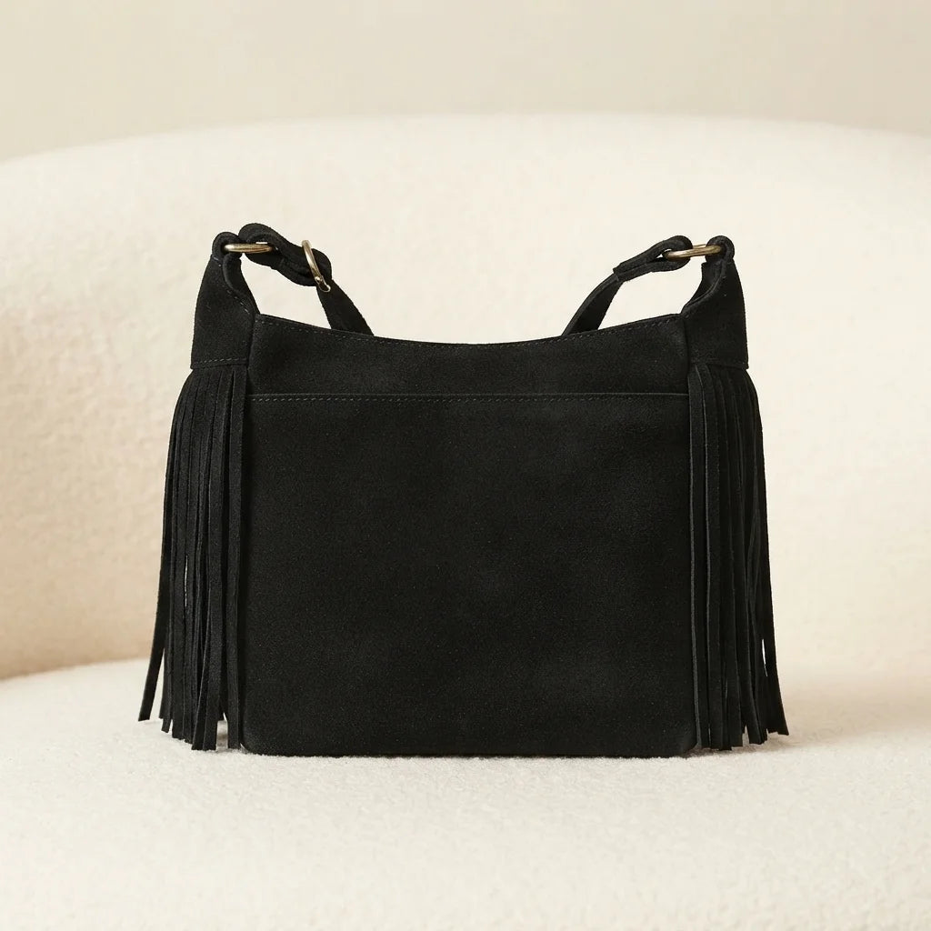 Back panel of Black vintage fringe hobo bag with strap attachments
