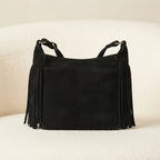 Back panel of Black vintage fringe hobo bag with strap attachments