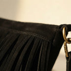 Close-up of fringe stitching and texture on Black vintage fringe hobo bag