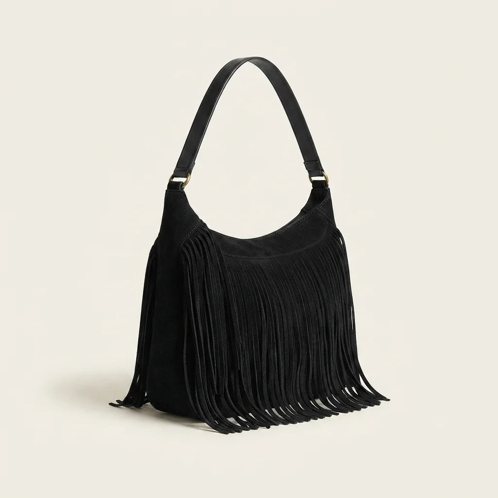 Black vintage fringe hobo bag, three-quarter angle showing side depth