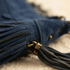 Close-up of fringe stitching and texture on Blue vintage fringe hobo bag