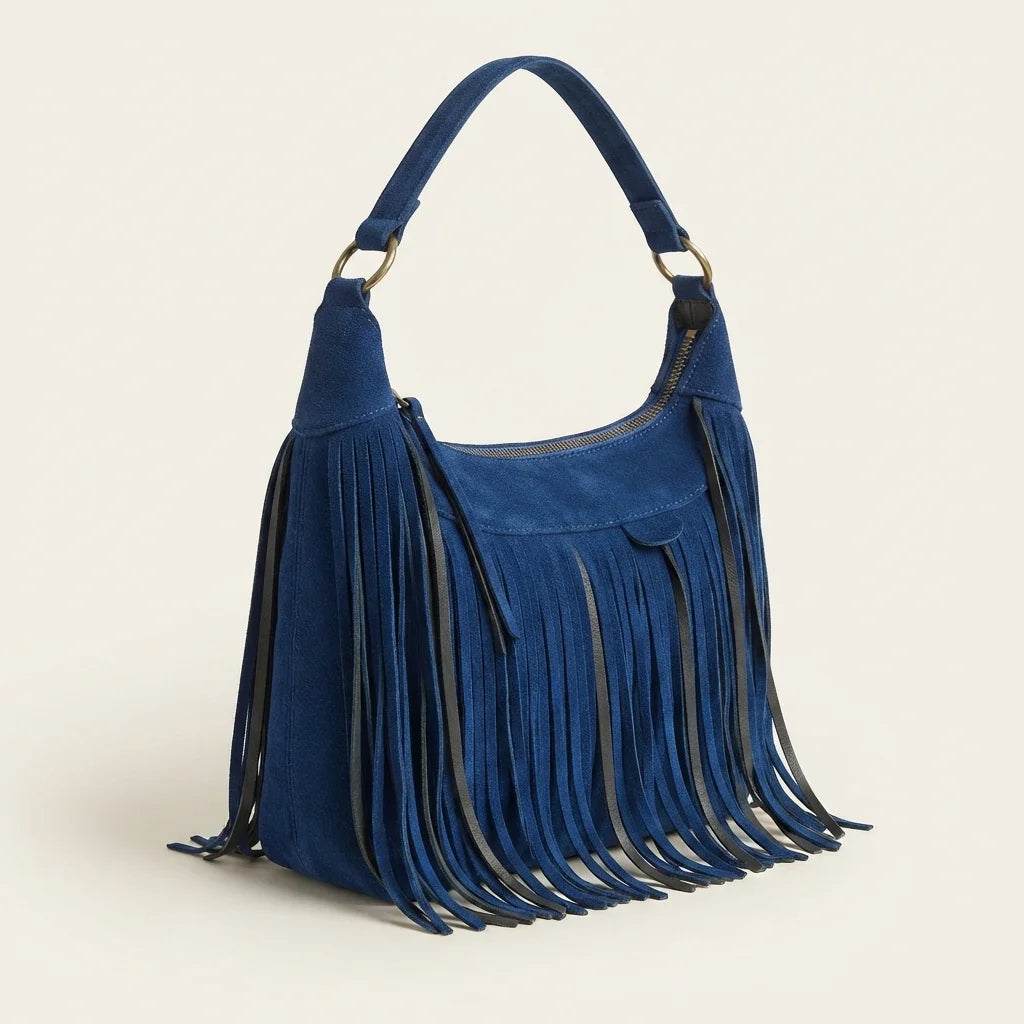 Blue vintage fringe hobo bag, three-quarter angle showing side depth