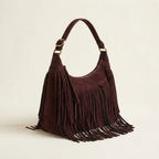Brown vintage fringe hobo bag, three-quarter angle showing side depth