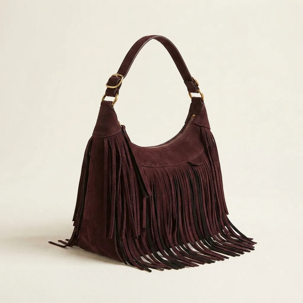 Brown vintage fringe hobo bag, three-quarter angle showing side depth
