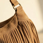 Close-up of fringe stitching and texture on Light Brown vintage fringe hobo bag
