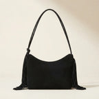 Back panel of Black vintage suede fringe bag with strap attachments