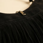 Close-up of fringe stitching and texture on Black vintage suede fringe bag