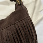 Close-up of fringe stitching and texture on Coffee vintage suede fringe bag