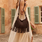 Woman wearing Coffee vintage suede fringe bag with swaying fringe