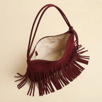 Interior lining and pockets of Red vintage suede fringe bag