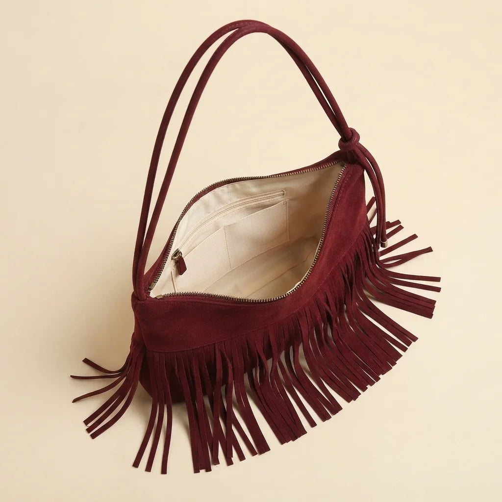 Interior lining and pockets of Red vintage suede fringe bag