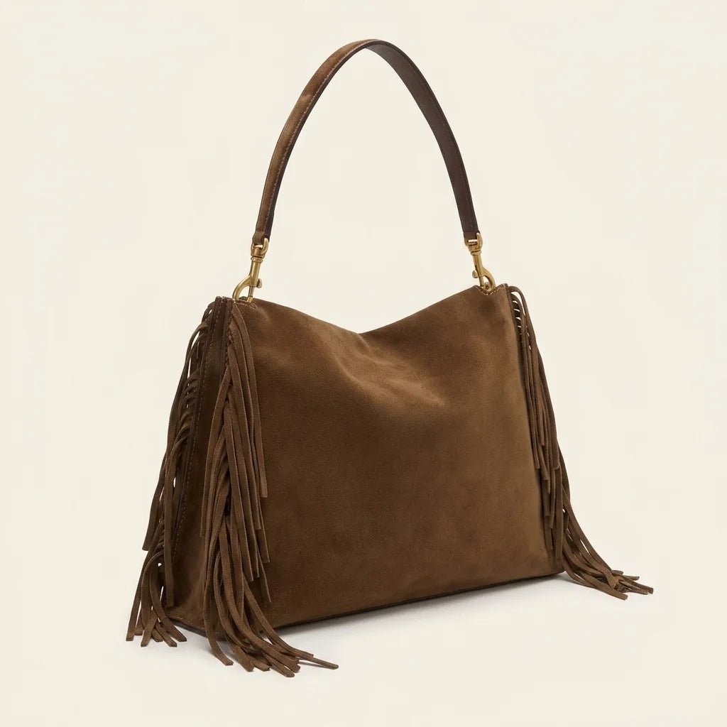 Brown western fringed hobo bags, three-quarter angle showing side depth