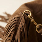 Close-up of fringe stitching and texture on Coffee western fringed hobo bags