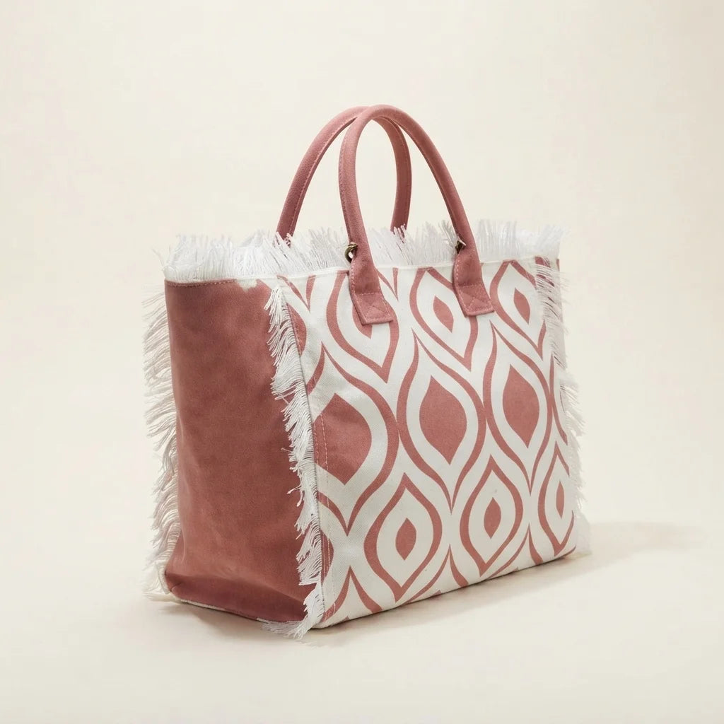 Pink & White white fringe beach bag, three-quarter angle showing side depth