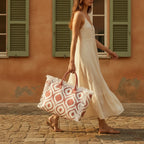 Woman wearing Pink & White white fringe beach bag with swaying fringe