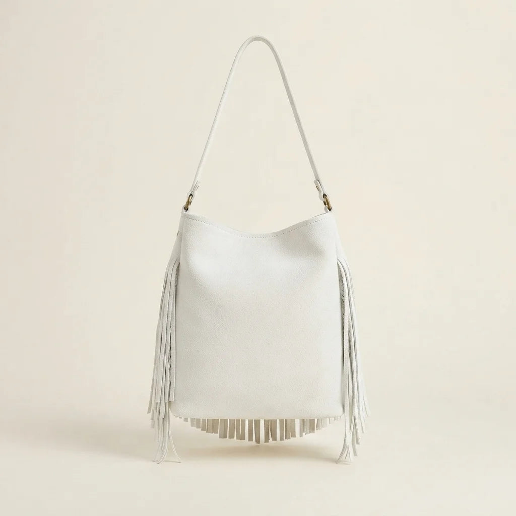 Back panel of White white fringe bucket bag with strap attachments