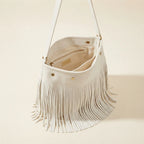 Interior lining and pockets of White white fringe bucket bag