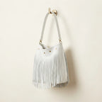 White white fringe bucket bag, three-quarter angle showing side depth