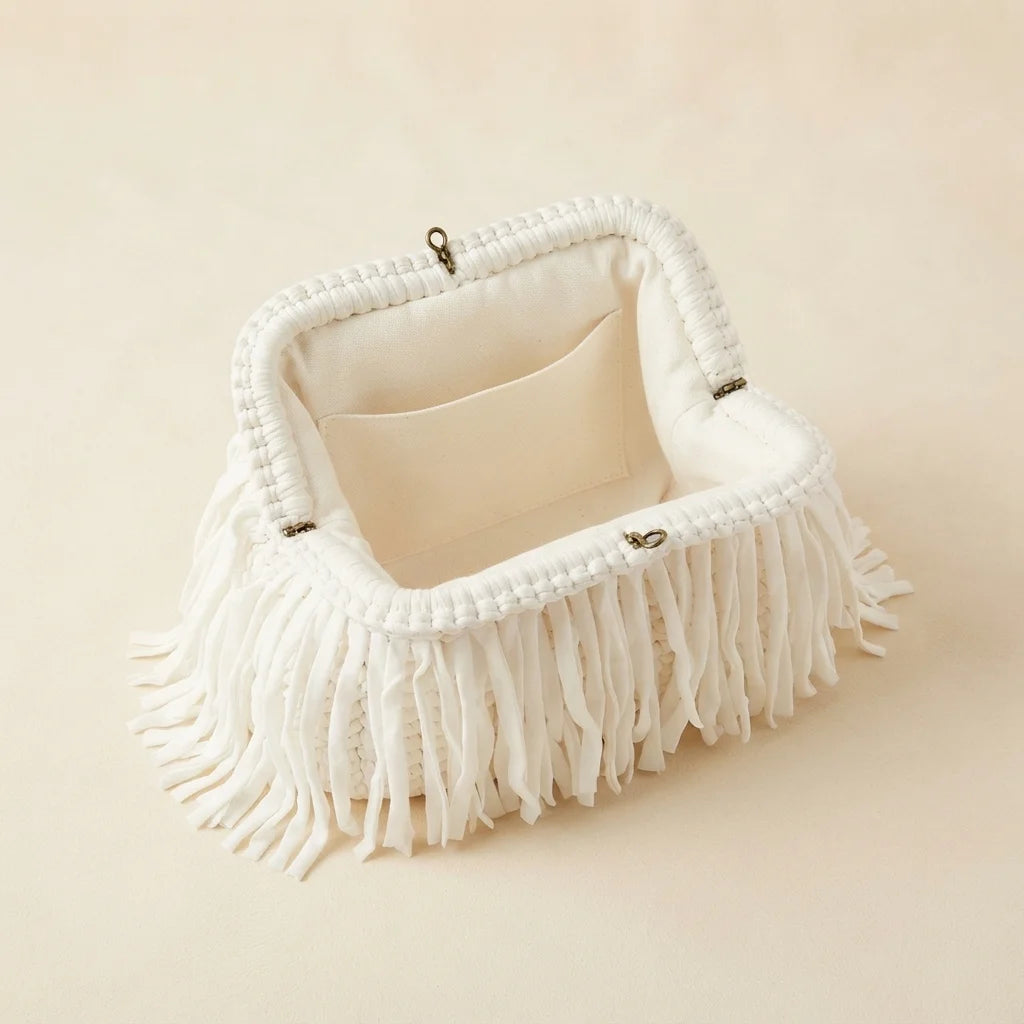 Interior lining and pockets of White white fringe clutch bag