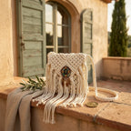White white fringe crossbody bag styled in a warm Mediterranean setting