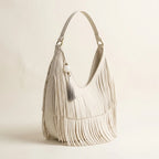 White white fringe hobo bag, three-quarter angle showing side depth