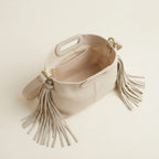 Interior lining and pockets of Cream white fringe shoulder bag