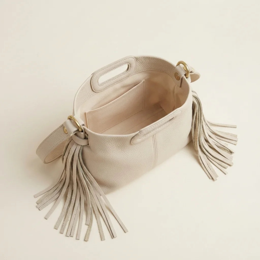 Interior lining and pockets of Cream white fringe shoulder bag