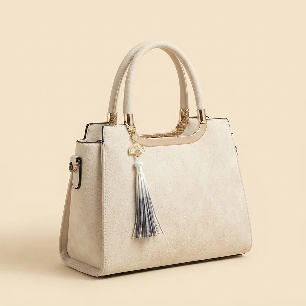 Ivory white fringe tote bag, three-quarter angle showing side depth