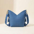 Back panel of Blue woven fringe bag with strap attachments