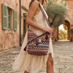 Woman wearing Wine Red woven fringe bag with swaying fringe