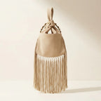 Back panel of Beige wristlet fringe bag with strap attachments
